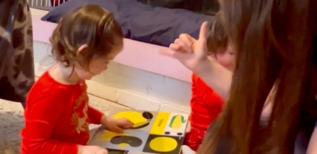 Twin born with partial hearing loss learns sign language