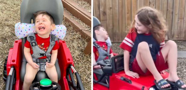 2-year-old plays with brother outside on adaptable car