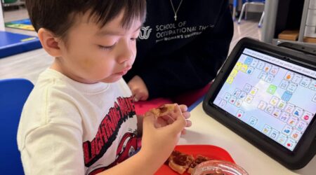 What makes The Warren Center different shown through pediatric therapy session in Dallas with therapist and child